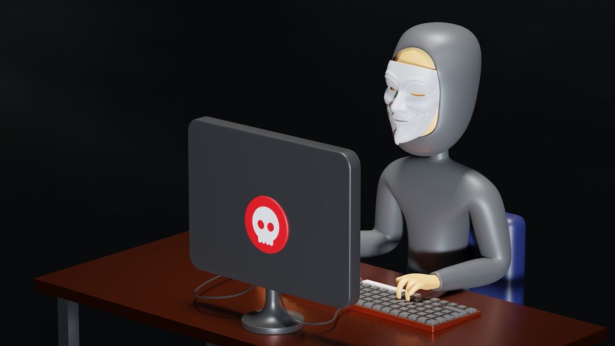 Person ved et skrivebord med datamaskin